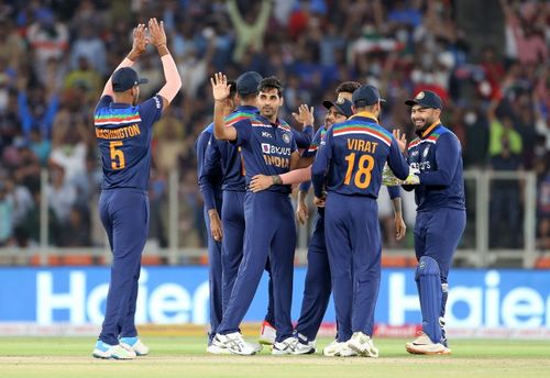 Bhuvneshwar Kumar celebrates with his teammates during the third ODI against England.