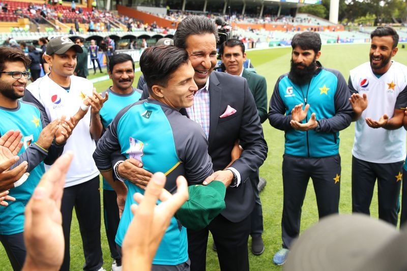 Wasim Akram in a huddle with the Pakistan team.