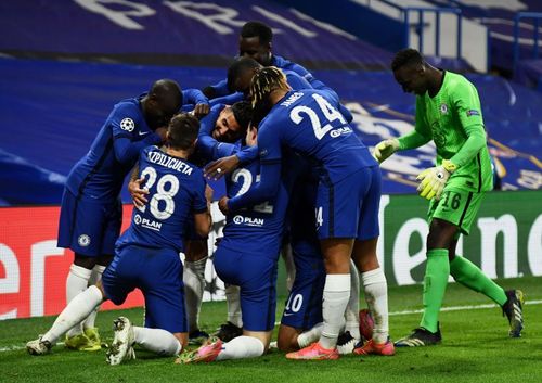 Chelsea players celebrate Emerson Palmieri's last-minute goal against Atletico.