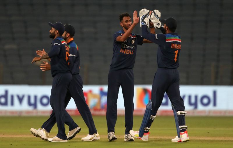Prasidh Krishna celebrating the fall of a wicket with teammates.