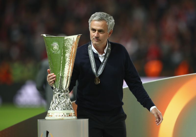 Jose Mourinho lifting the 2017 Europa League title with Manchester United