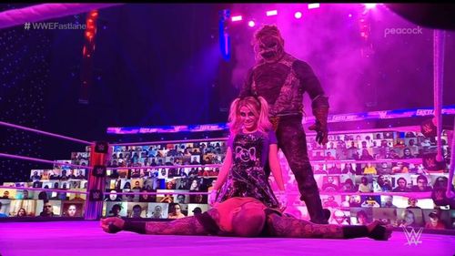 The Fiend and Alexa Bliss posing over Randy Orton