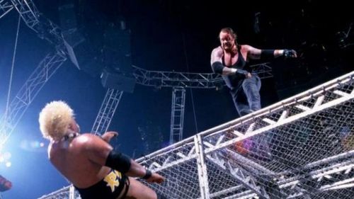 The Undertaker throws Rikishi off of Hell in a Cell