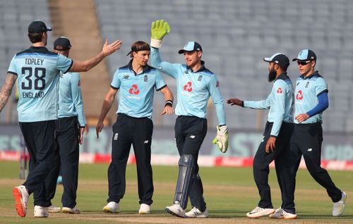 Jos Buttler celebrates a wicket with the England team