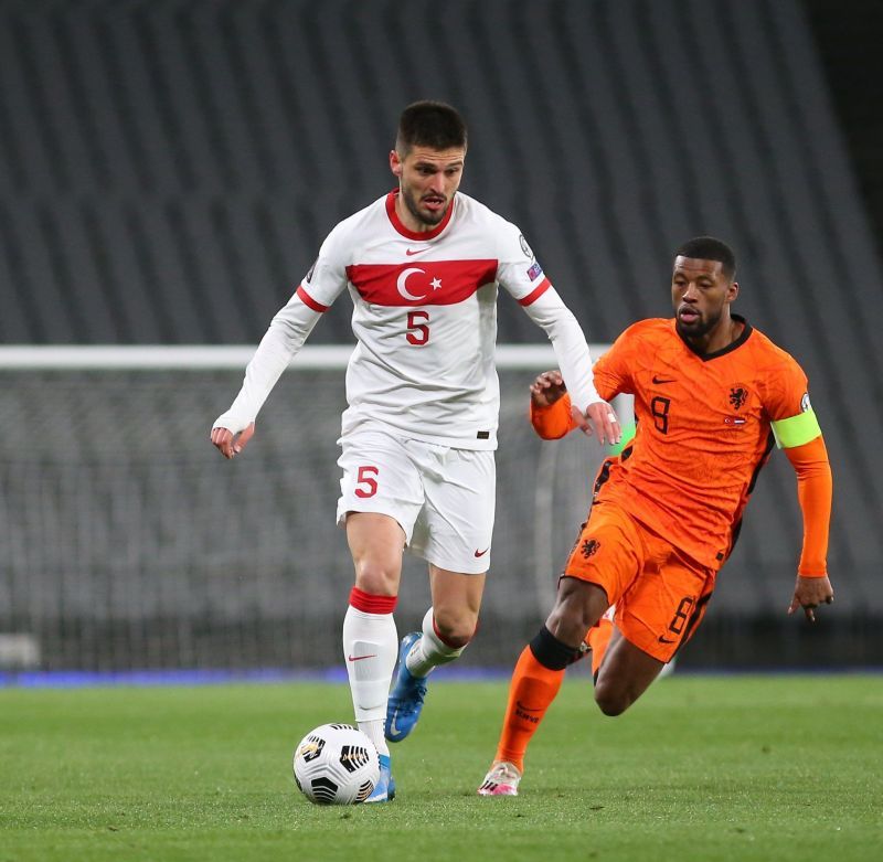 Georginio Wijnaldum (R) tussles it out for the ball
