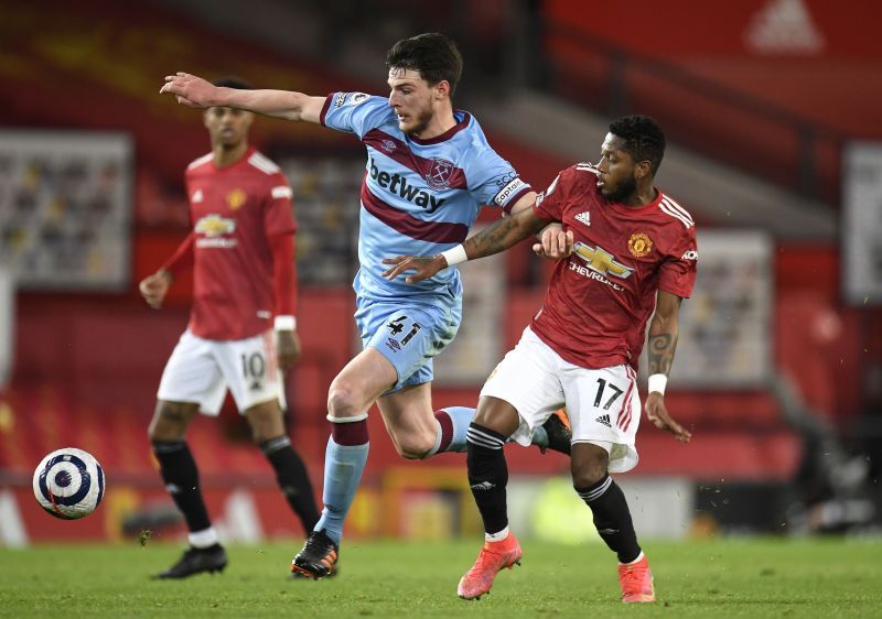 Declan Rice tussles with Fred