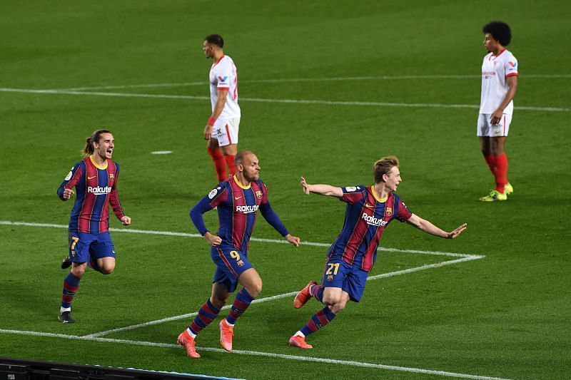 Barcelona fought back from a 2-0 deficit to beat Sevilla in the league cup.