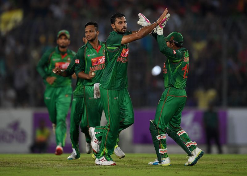 Mashrafe Mortaza celebrating a fall of a wicket with his teammates