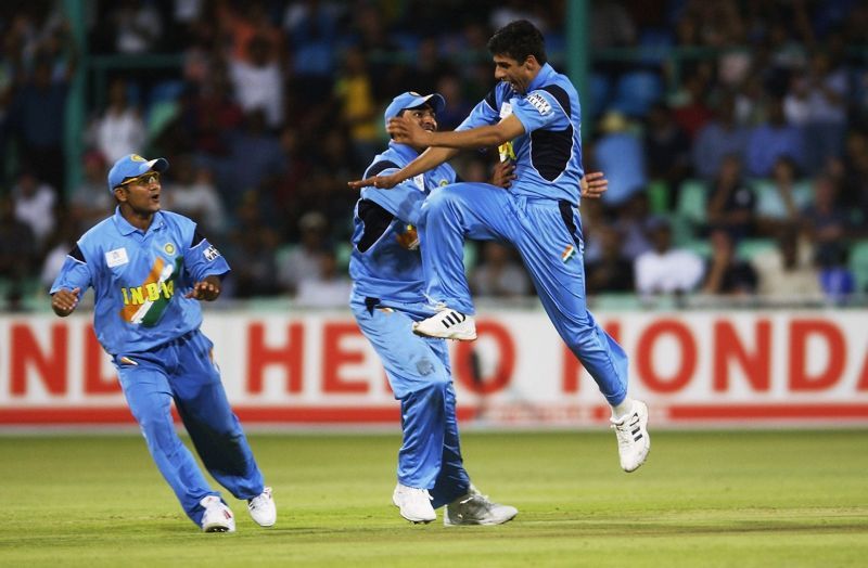 Ashish Nehra of India celebrates the wicket of Craig White of England.