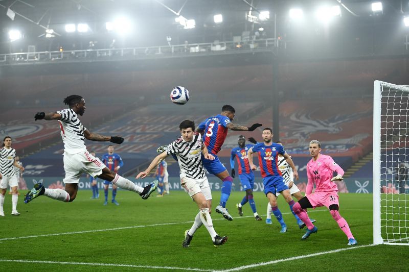Aaron Wan-Bissaka and Harry Maguire press for the opener off a set-piece.