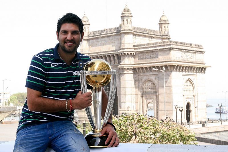 Yuvraj Singh, the Player of the Tournament of the 2011 World Cup, poses with the trophy in Mumbai.