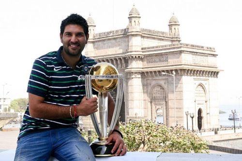 Yuvraj Singh, the Player of the Tournament of the 2011 World Cup, poses with the trophy in Mumbai.