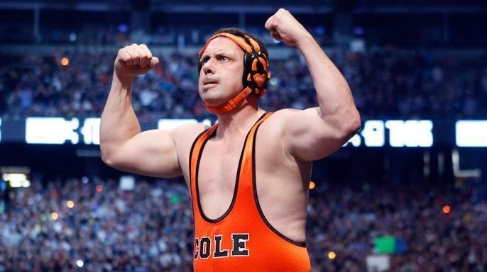 Michael Cole wore an orange singlet against Jerry Lawler
