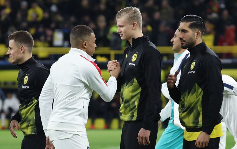 Kylian Mbappe and Erling Haaland greet each other before a game