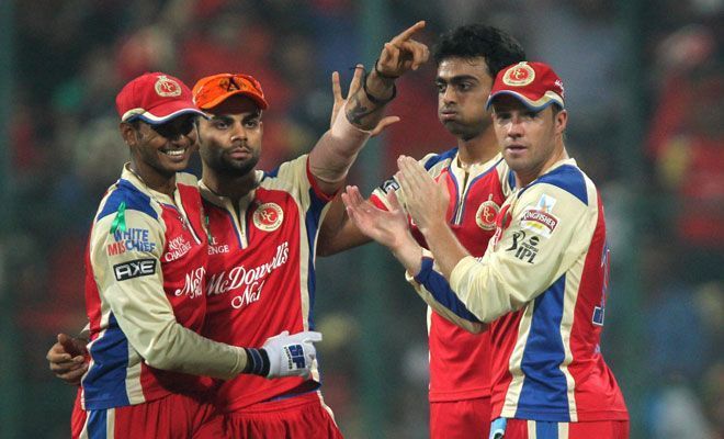 RCB players celebrate a wicket during the encounter against Delhi (Source: PTI)