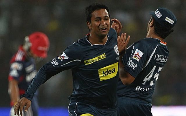 Pragyan Ojha celebrates a wicket with Rohit Sharma in IPL 2010.