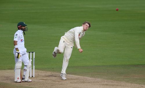 Dom Bess (R) in his bowling action.