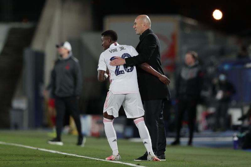 Vinicius Jr (L) and Zinedine Zidane