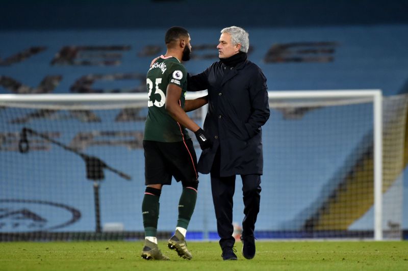 Japhet Tanganga (left) and Jose Mourinho after a game