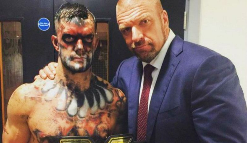 Triple H backstage with Finn Balor