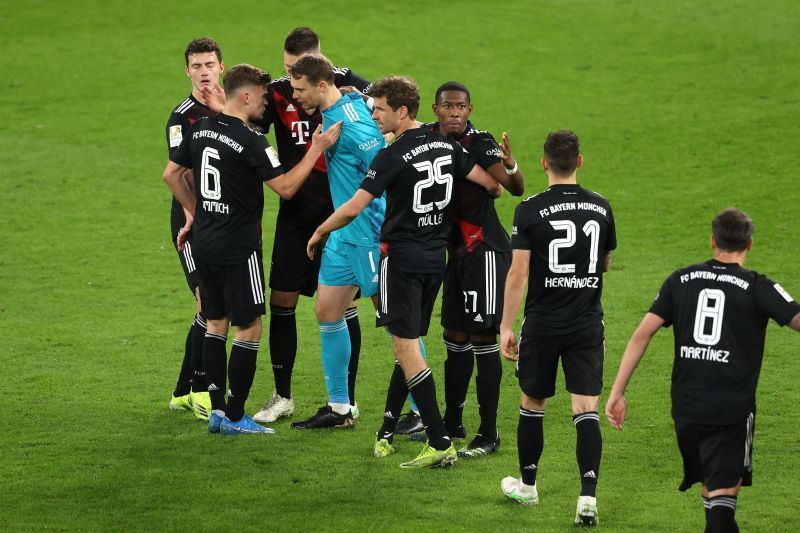 Bayern players celebrate the win at full-time.