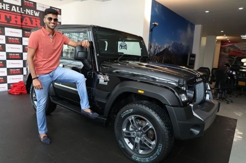 Washington Sundar poses with the Mahindra Thar. Pic: Washington Sundar/ Twitter