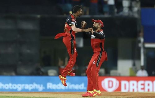 Virat Kohli (right) celebrates the wicket of SRH batsman Abdul Samad with Shahbaz Ahmed. (Photo: BCCI)