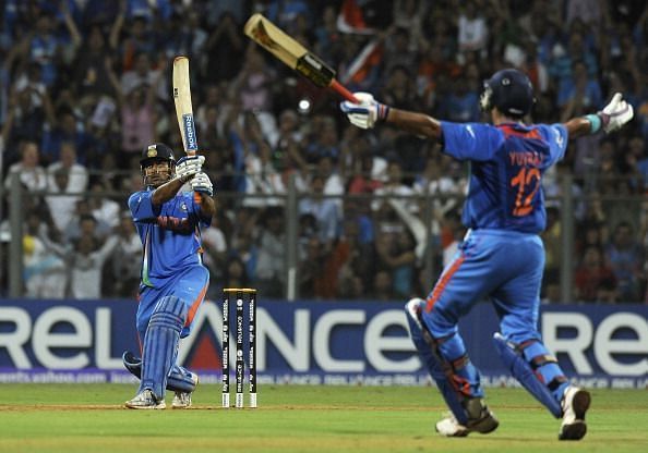 MS Dhoni's six that won India the 2011 World Cup. An ecstatic Yuvraj Singh celebrates in the background