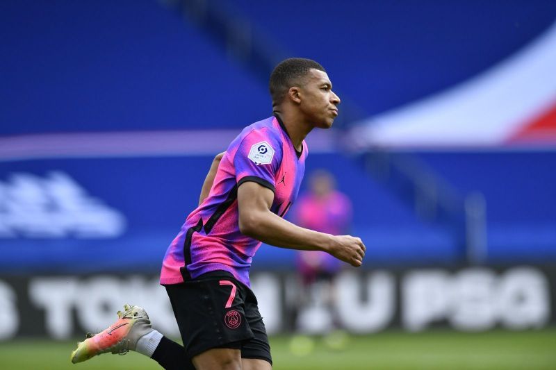 Kylian Mbappe celebrates after scoring for PSG.