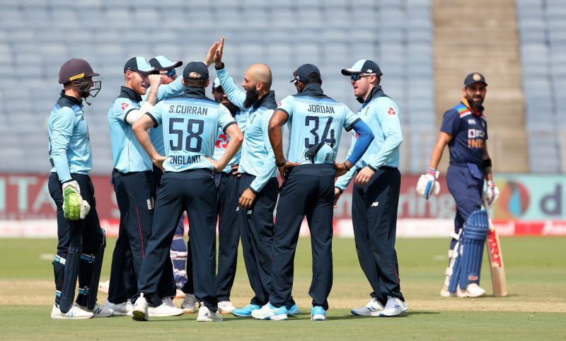 England cricket team celebrating a fall of a wicket.