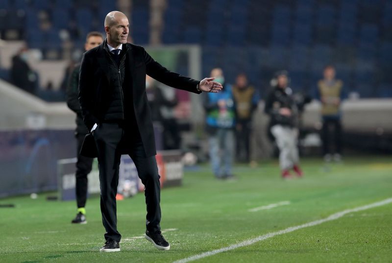 Real Madrid boss Zinedine Zidane watches on during a Champions League clash