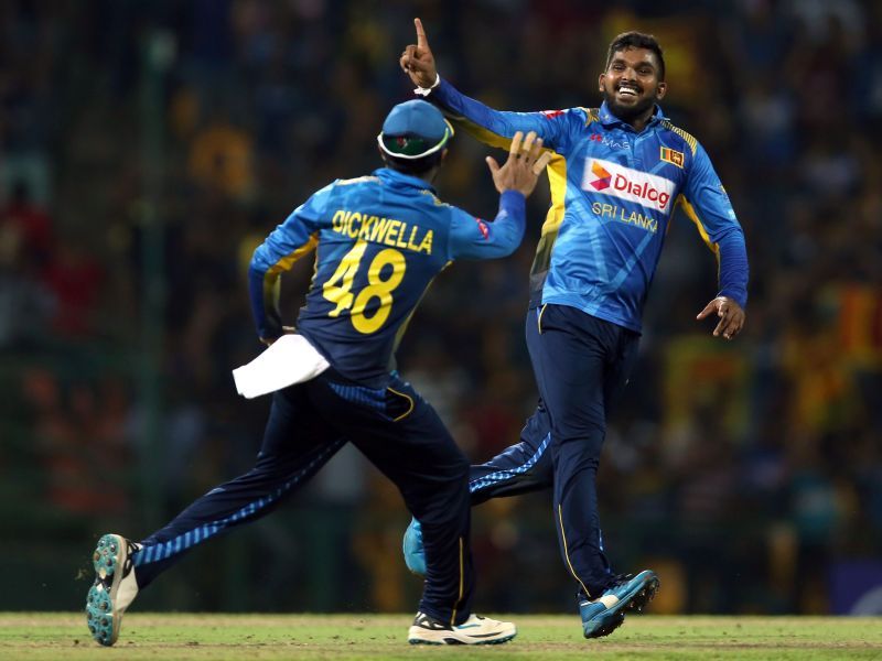 Wanindu Hasaranga (right) celebrating a wicket.