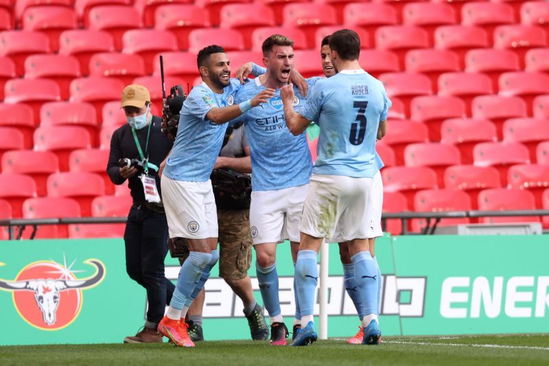 Laporte (Centre) celebrating the winner for Manchester City