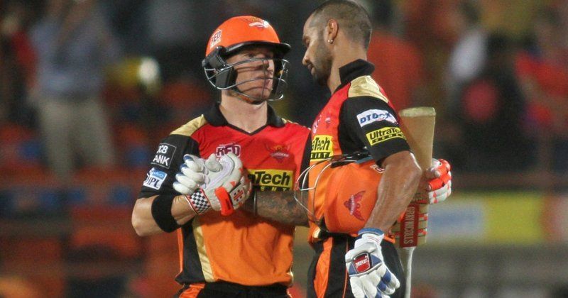 Dhawan and Warner celebrate a victory together.