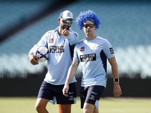 Nathan Lyon (L) with Steve Smith.