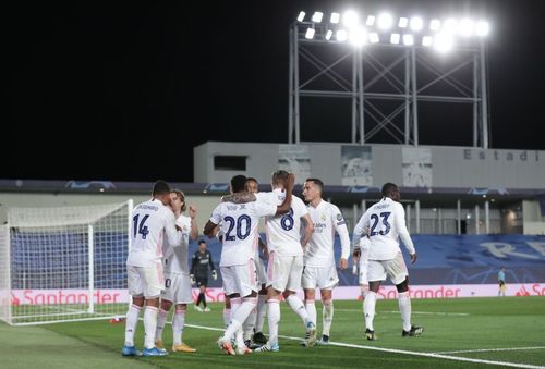 Real Madrid players celebrate against Liverpool