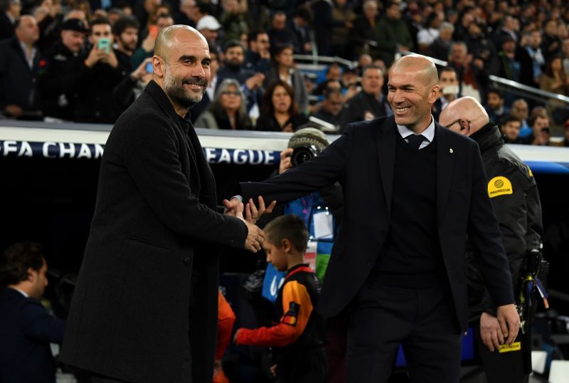 Pep Guardiola (left) and Zinedine Zidane (right) greet each other