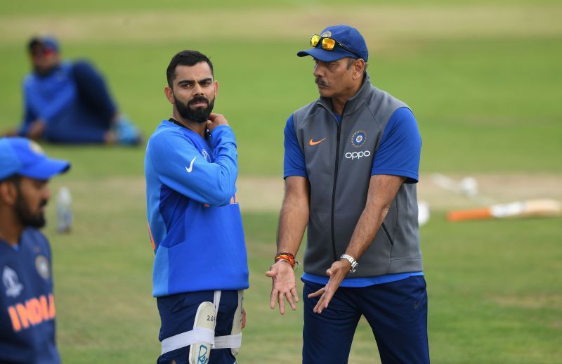 Virat Kohli (L) and Ravi Shastri