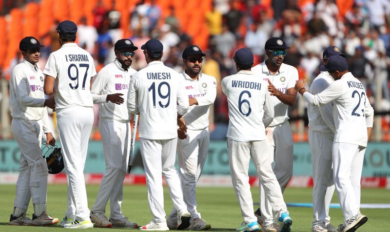 Team India celebrating a fall of a wicket.