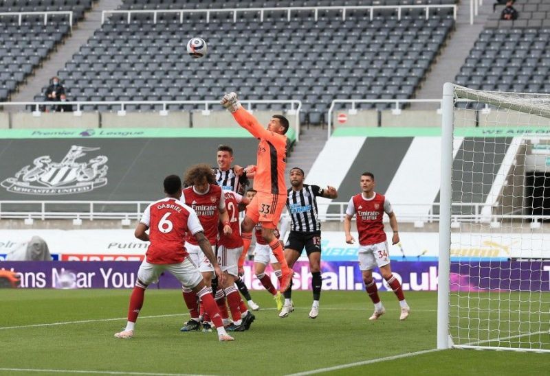 Mathew Ryan punching the ball away.