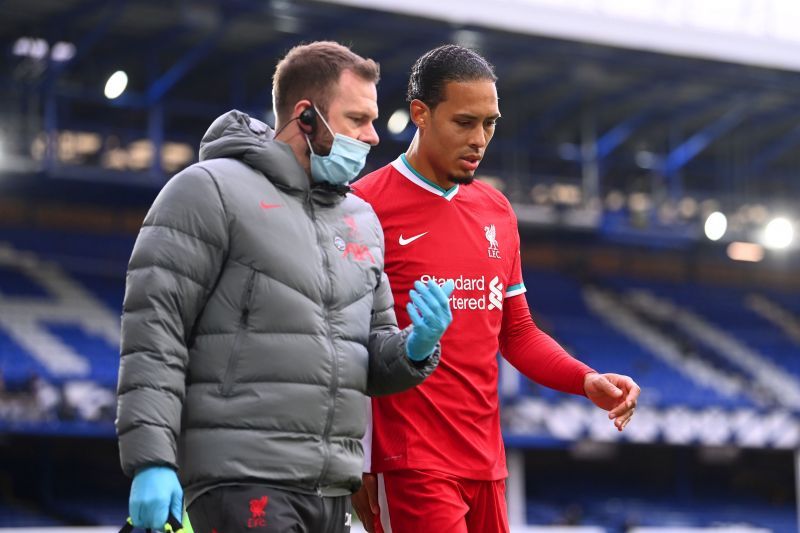 Virgil van Dijk in conversation with the club doctor.