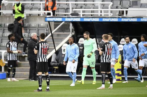 Manchester City being given a guard of honour after winning the Premier League by Newcastle United.