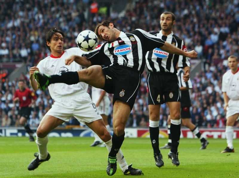 Filippo Inzaghi of AC Milan and Ciro Ferrara of Juventus tussle for posession of the ball