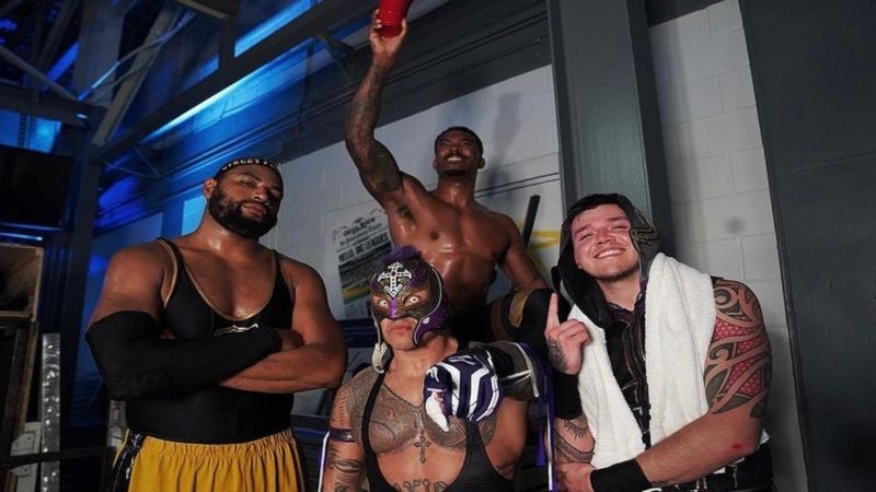 Angelo Dawkins, Montez Ford, Rey Mysterio, and Dominik Mysterio