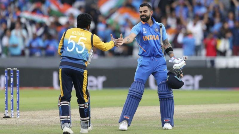Virat Kohli shakes hands with Kusal Perera after a 2019 World Cup game.