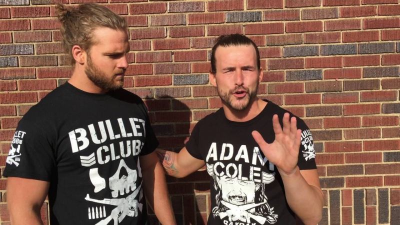 Hangman Page (left) with Adam Cole