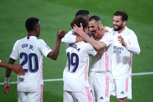 Real Madrid players celebrate a goal against Cadiz CF