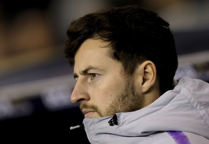 Ryan Mason looks on.