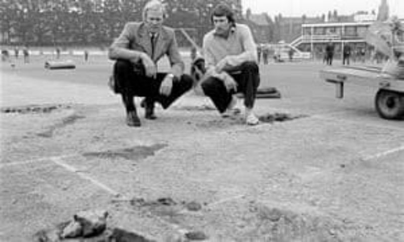 Ian Chappell and Tony Greig analyze the damage done to the Headingley pitch during the 1975 Ashes cricket match. Pic: @WSCupCricket/ Twitter