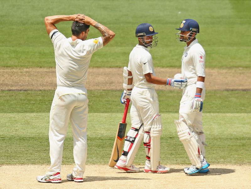 Virat Kohli (R) and Mitchell Johnson (L)